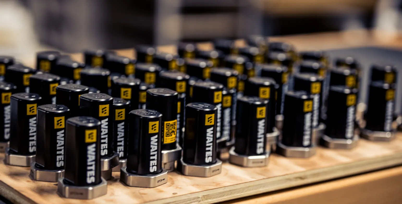 Rows of Waites wireless vibration sensors on a workbench